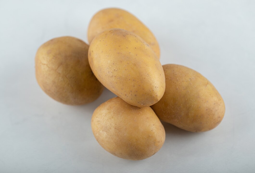 close-up-photo-pile-potatoes-white-background_114579-68729
