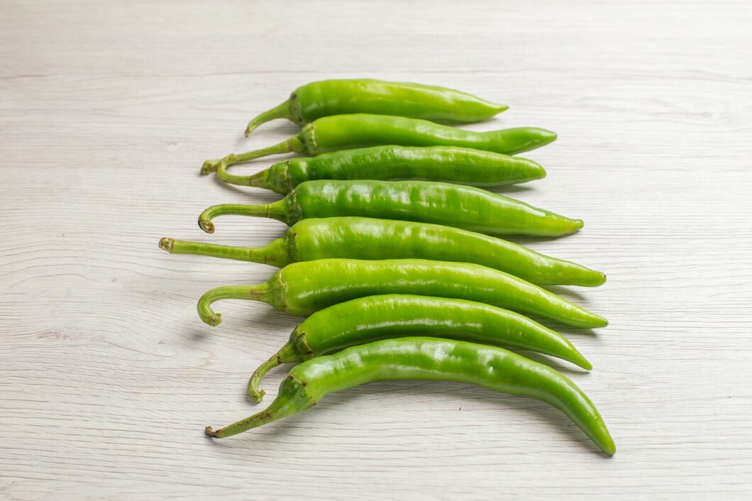 front-view-green-spicy-peppers-white-background-hot-edgy-ripe-salad-color-photo_140725-98256